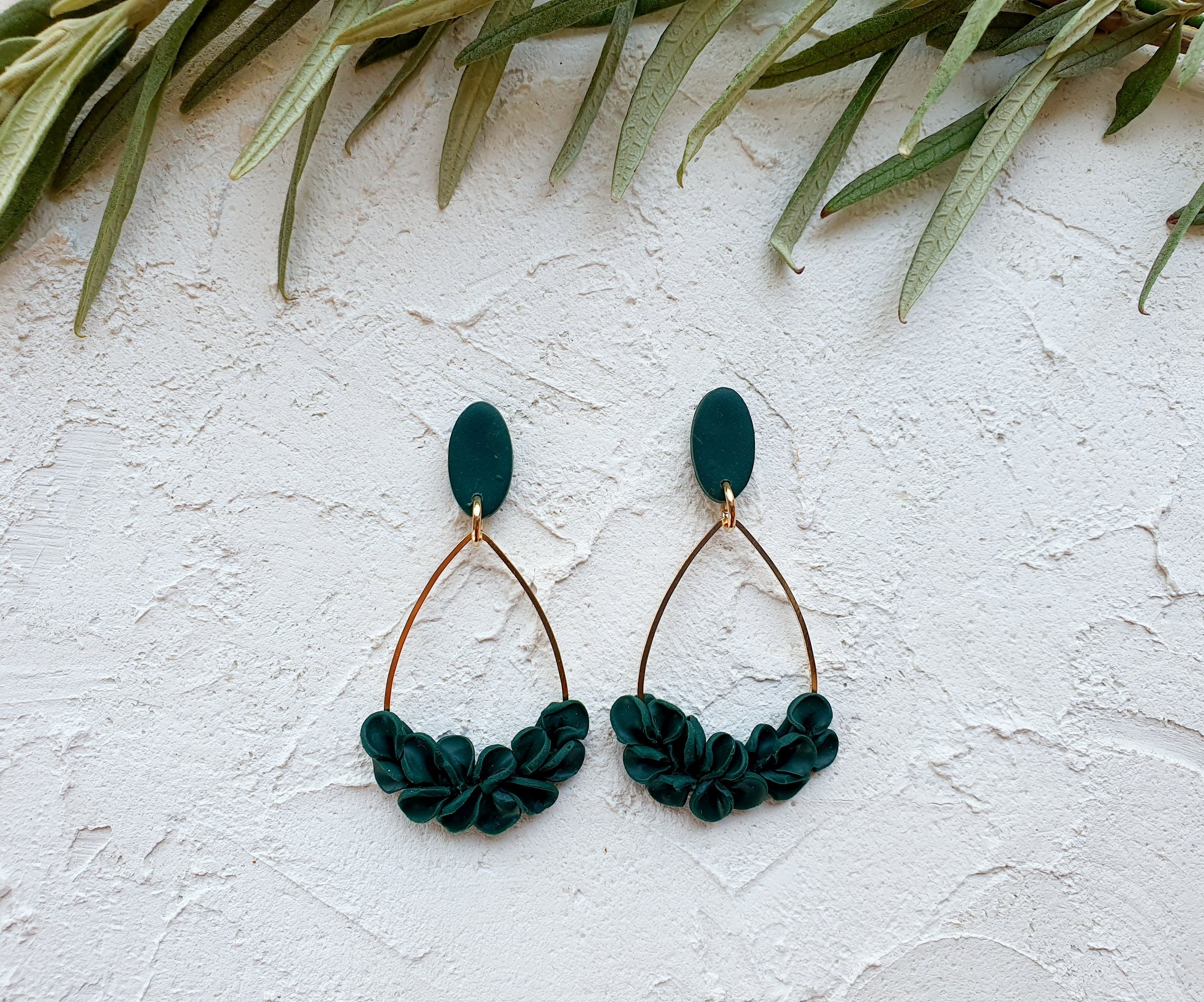 Emerald leaves on gold charm