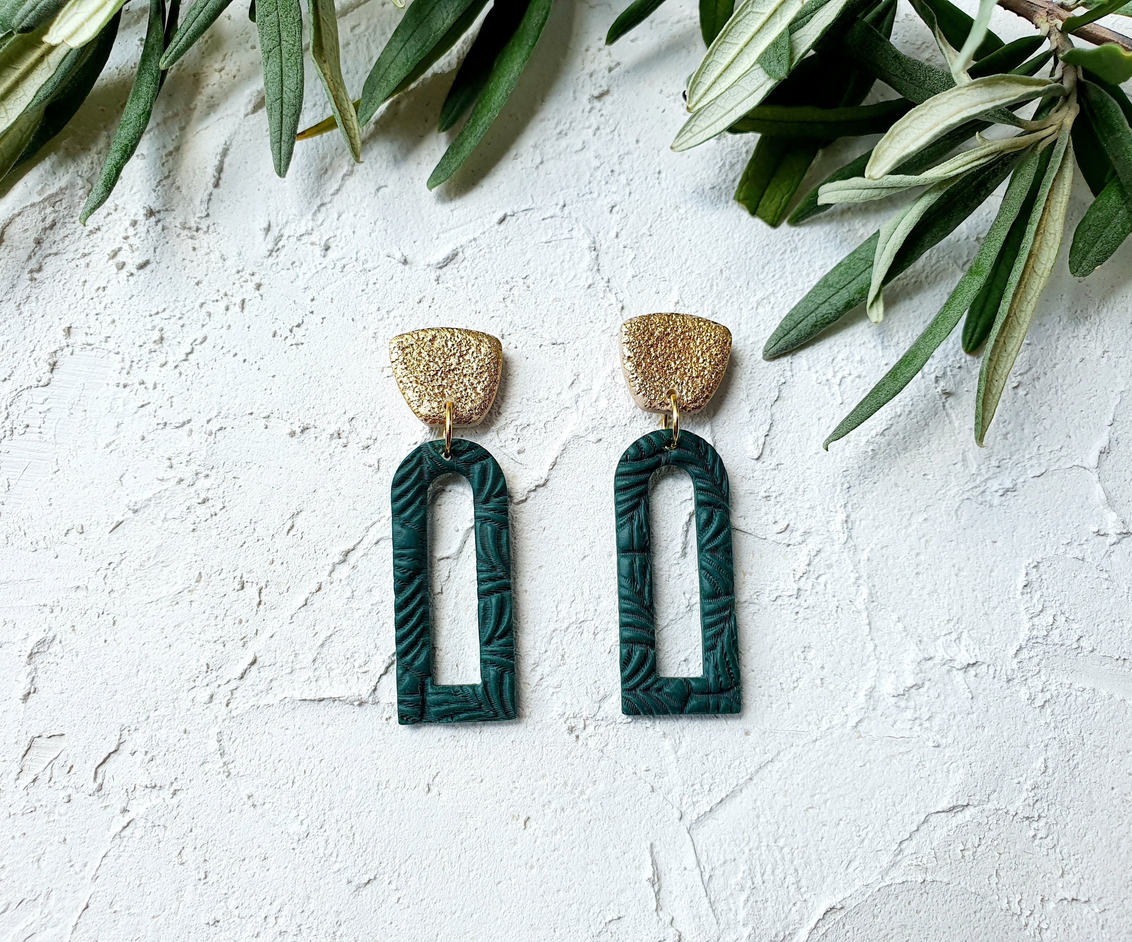 Emerald open arch with gold leaf