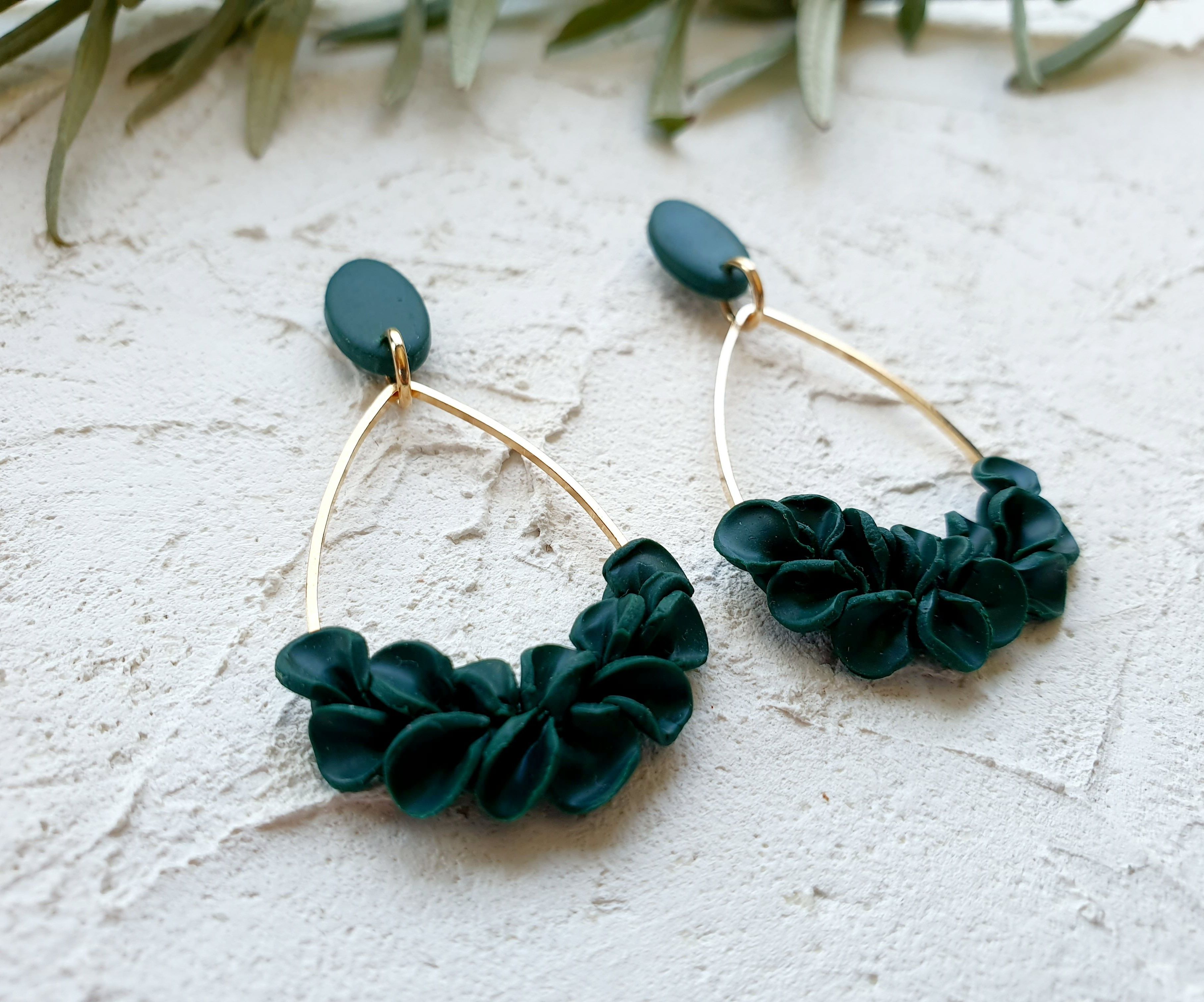 Emerald leaves on gold charm