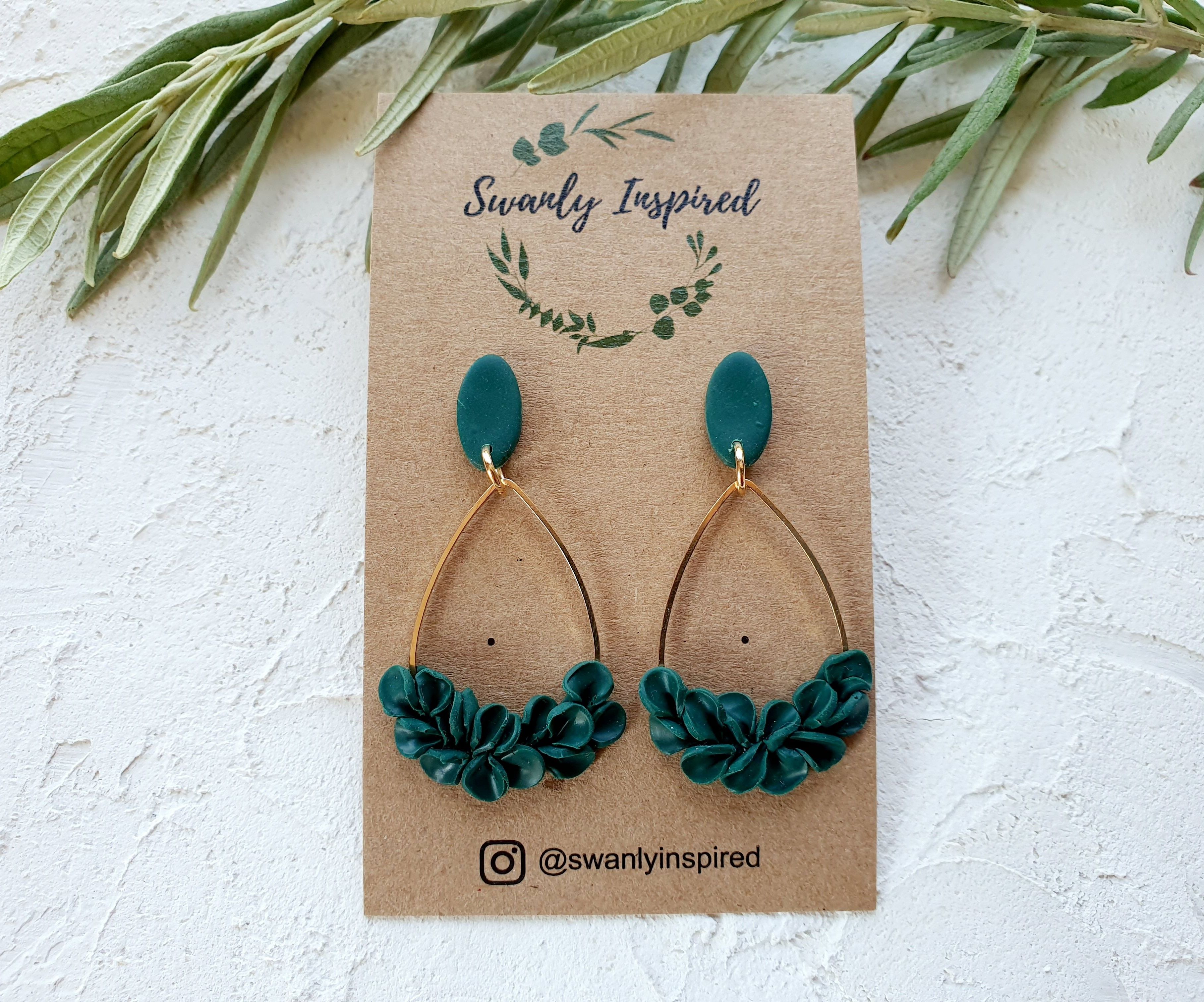 Emerald leaves on gold charm