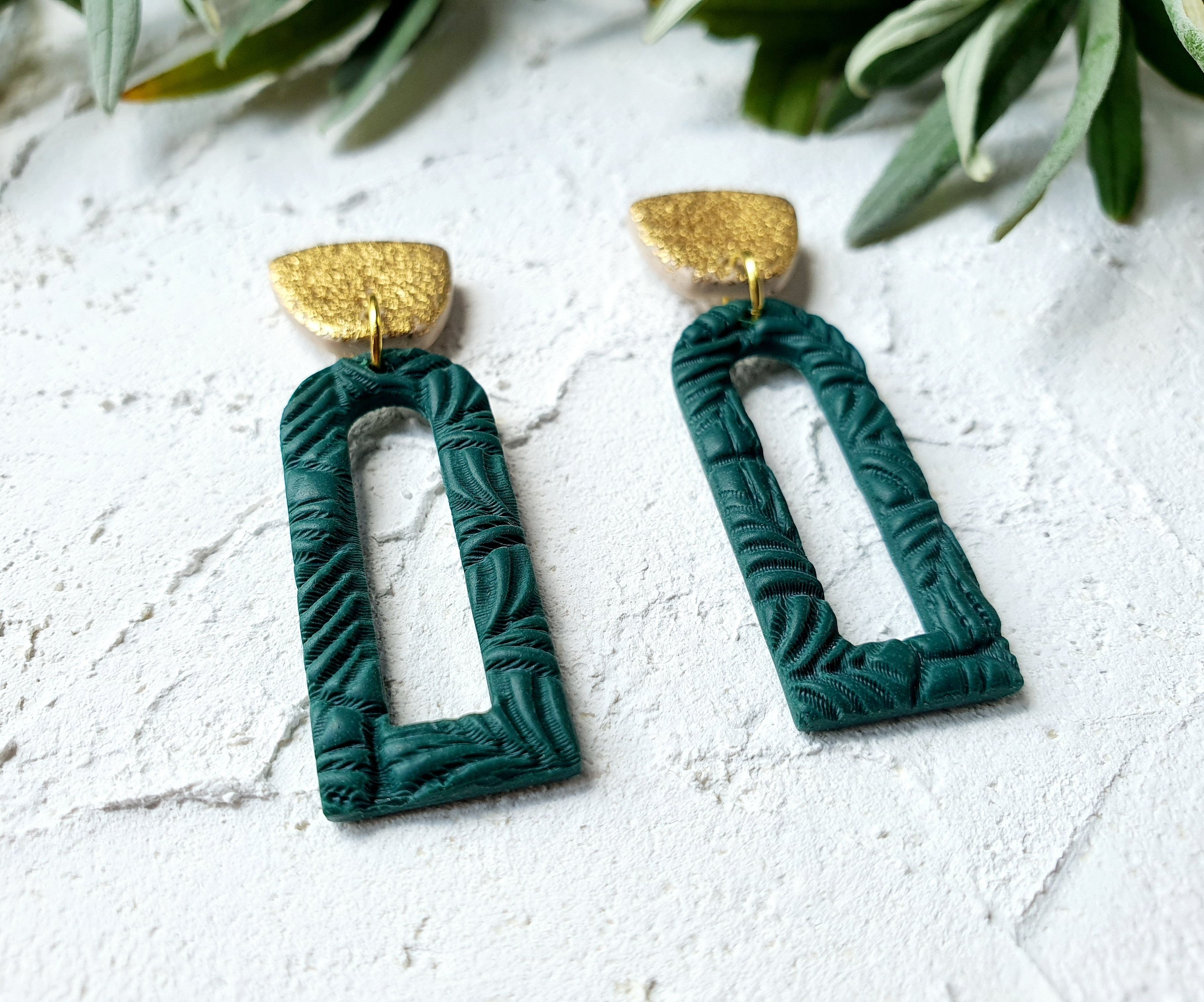 Emerald open arch with gold leaf